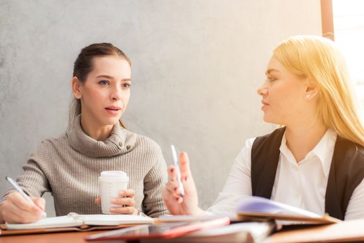 Female business owners collaborating on strategy and ideas