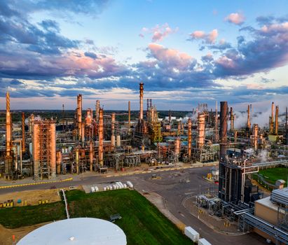 Oil Price Collapse Fuels Indian Market Surge as Diplomatic Hopes Ease Global Tensions 1 Energy infrastructure with sunset lighting reflecting economic impacts