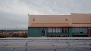 boarded windows on a street corner
