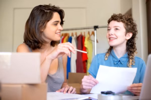 women entrepreneurs collaborating in a modern small business office setting