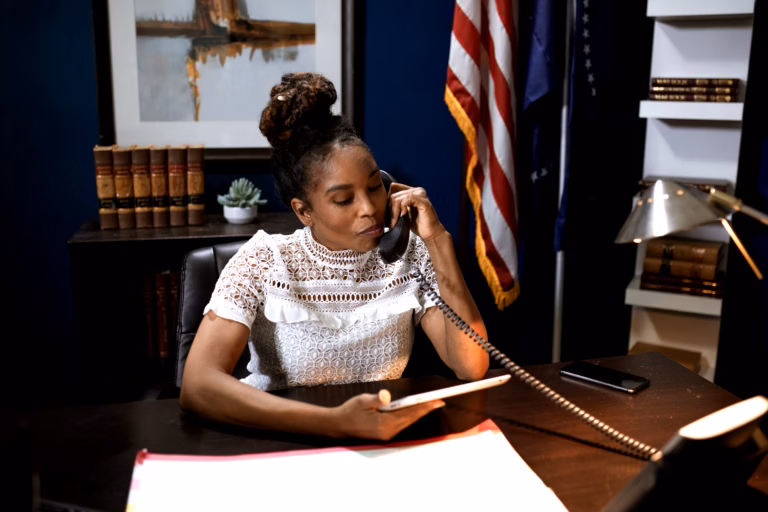 First Woman Becomes Williamsburg City Manager After 94 Years of Male Leadership 1 Professional woman in office setting managing documents and meetings