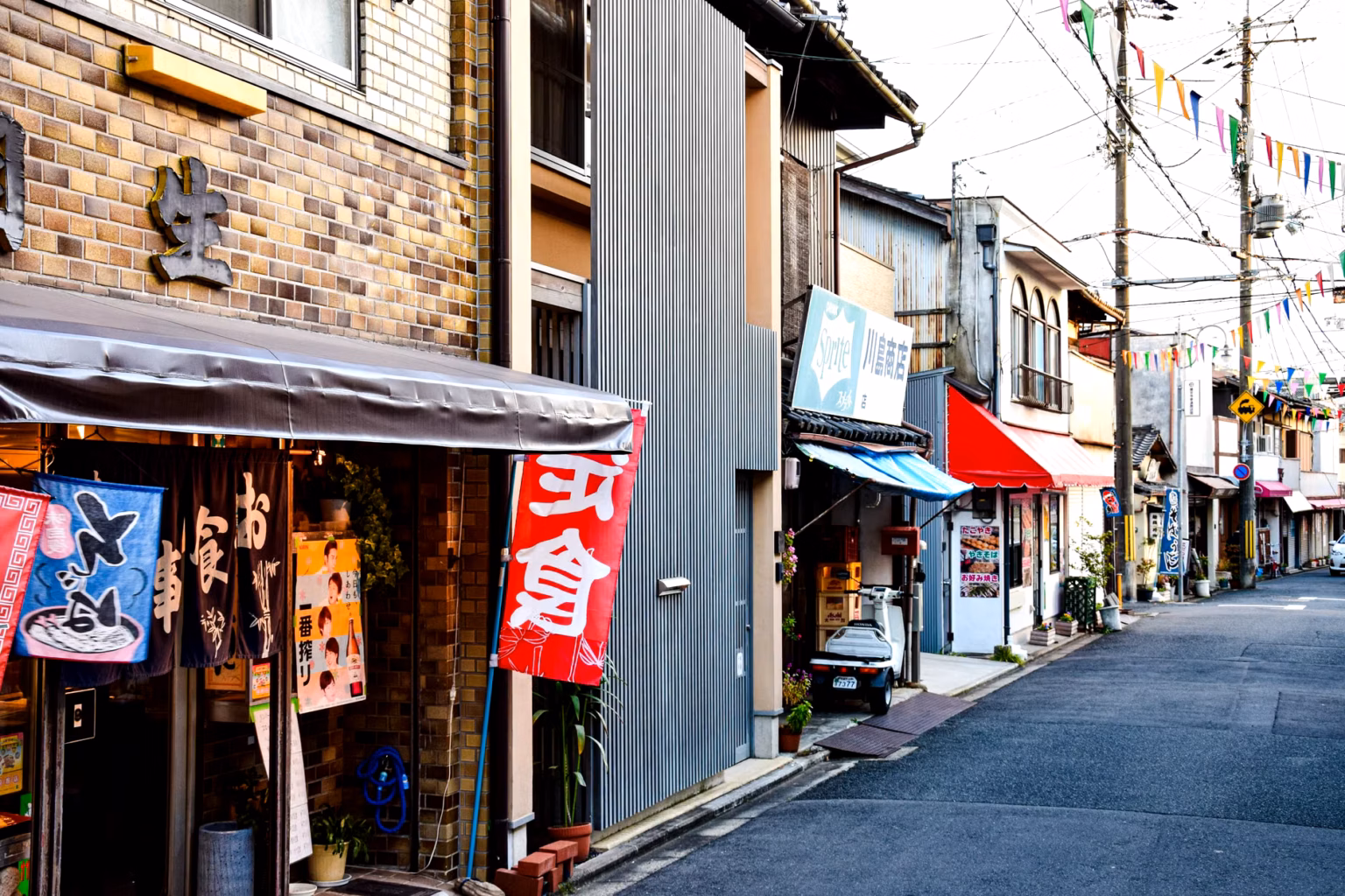 Older Japanese woman smiling in a quiet urban neighborhood