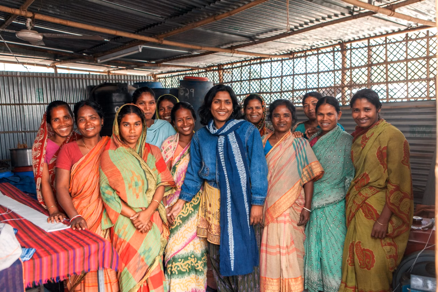 Group of women in colorful sarees working in a cooperative, Bangladesh