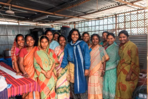 Group of women in colorful sarees working in a cooperative, Bangladesh