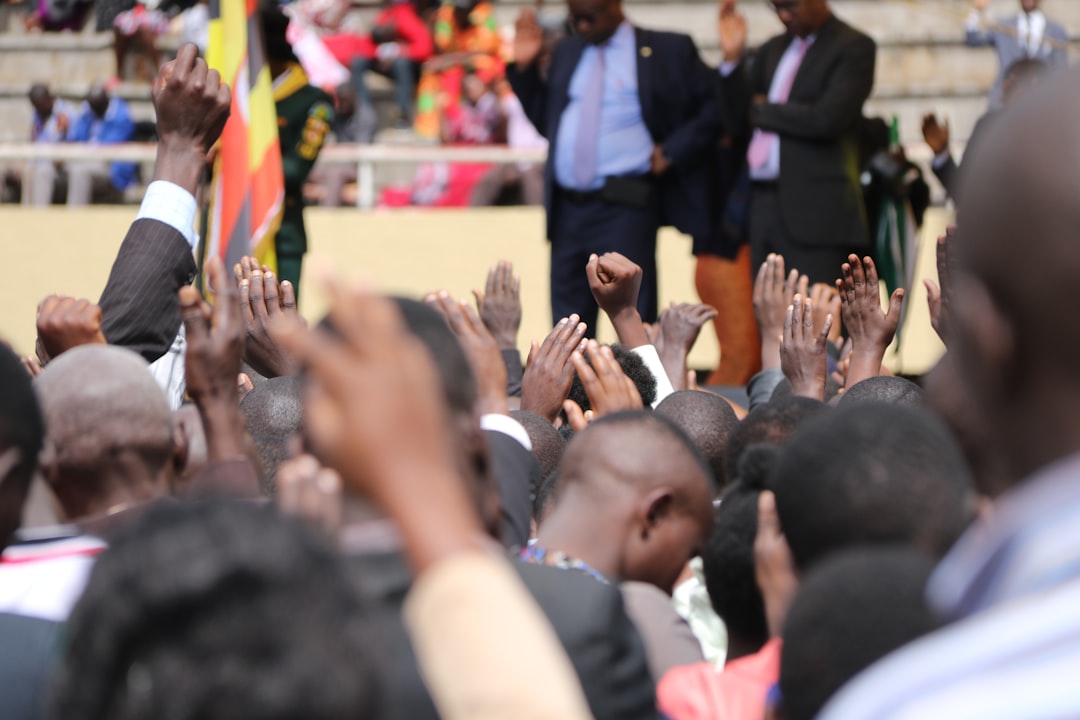Officials and young entrepreneurs seated at a formal regional policy meeting