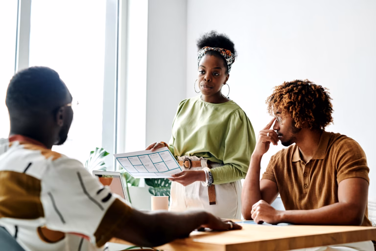 ECOWAS Opens Grants Up to $15,000 for West African Entrepreneurs 1 Young African woman presenting a business plan to a small group in a conference room