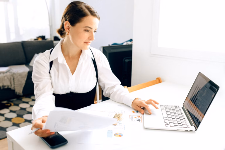 CII-IWN Brings Hands-On AI Training to Women in Chandigarh 2 A woman entrepreneur reviewing business data on a laptop in a professional setting