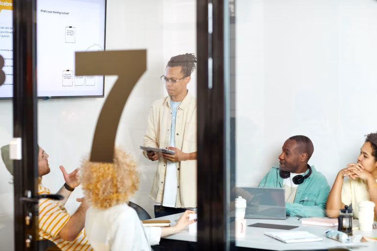 Colleagues from different backgrounds collaborating in an open office space
