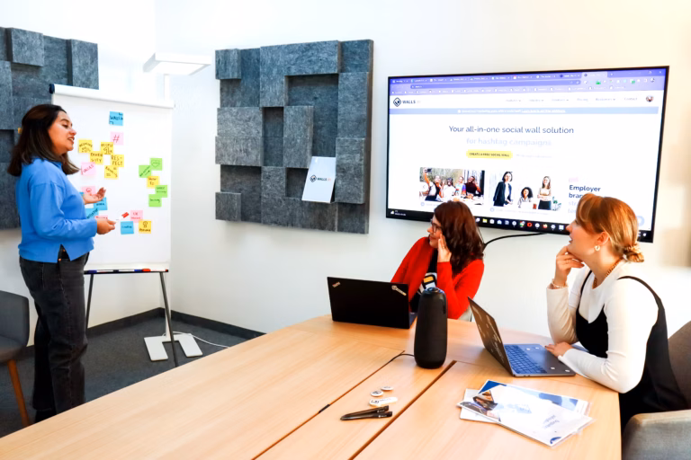 Aberdeenshire Launches Program to Boost Women-Led Businesses 2 A woman stands at the front of a room, presenting to a small group of attentive individuals