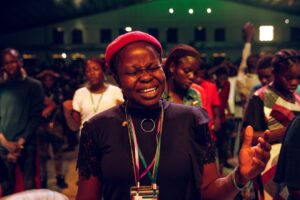 A confident Nigerian professional woman in a modern corporate environment