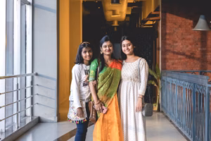A diverse group of women working collaboratively in a modern tech office setting in India