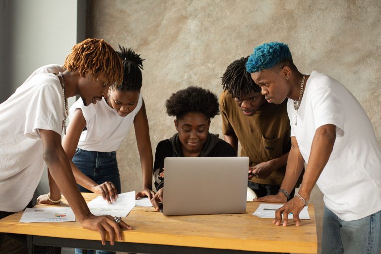 young people collaborating on business idea in modern lab space