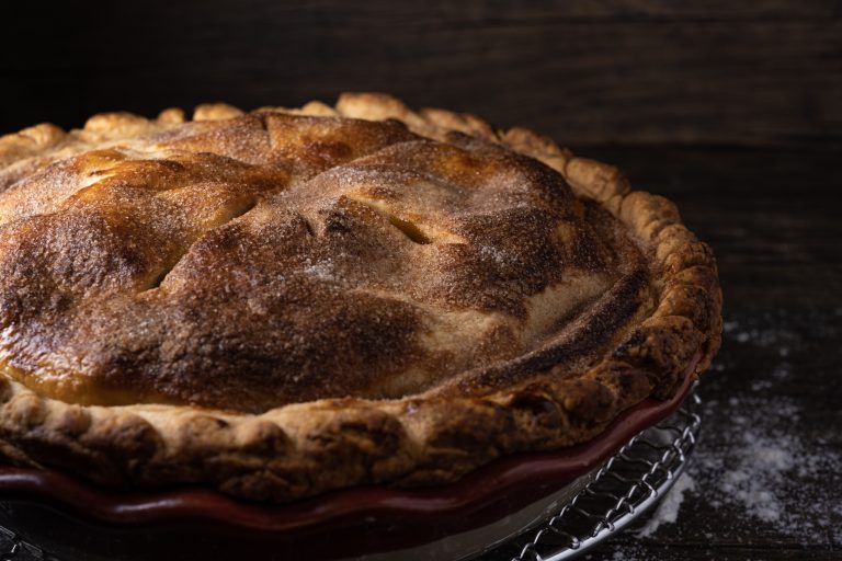 freshly baked apple pie with flaky golden crust and cinnamon filling