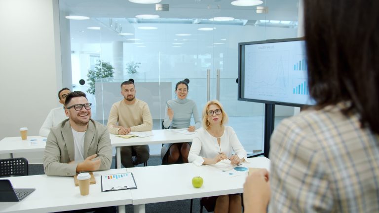 Corporate meeting with diverse team discussing growth strategies