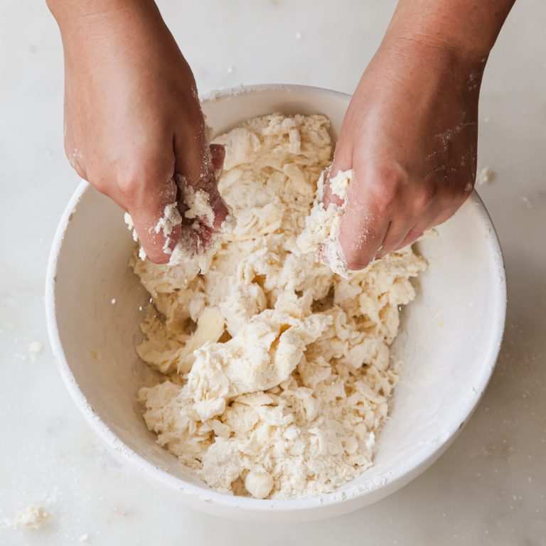 Small Business Women: Garcia, Bodine Earn County Honors 2 Hands preparing pastry dough with flour on a work surface