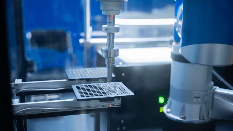 Twenty Female Founders Featured In Expanded Swiss AI Report 1 A robotic arm working above a tray in a laboratory, an illustrative stock scene