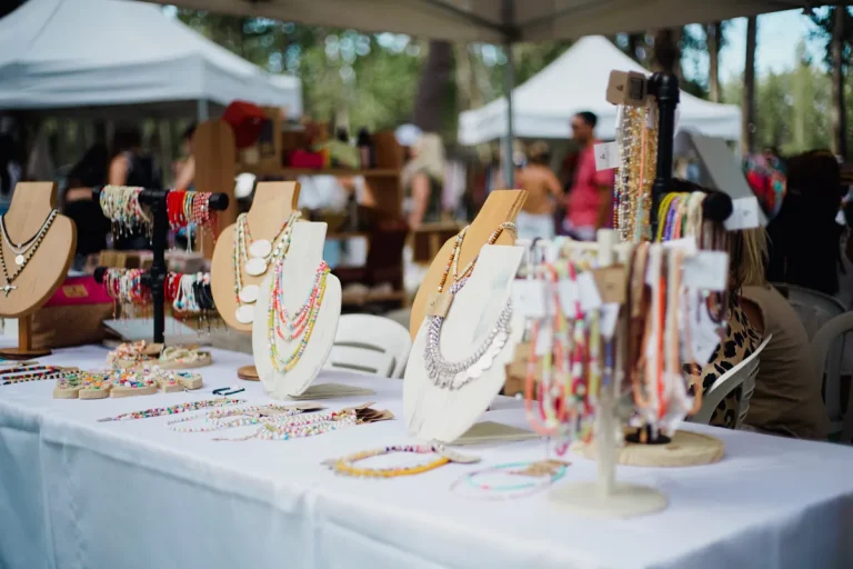 Beaded jewelry displayed at an outdoor craft market, an illustrative stock photograph