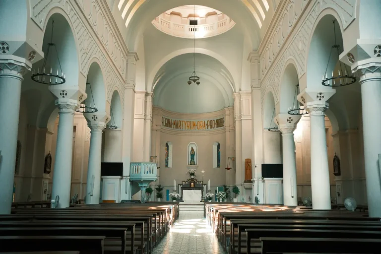 Wooden pews and an altar inside a church, an illustrative stock photograph