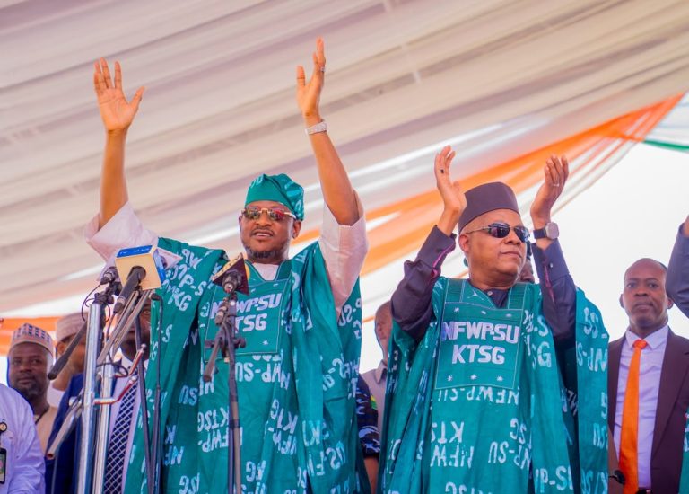 Katsina officials raising their hands at the women’s programme launch