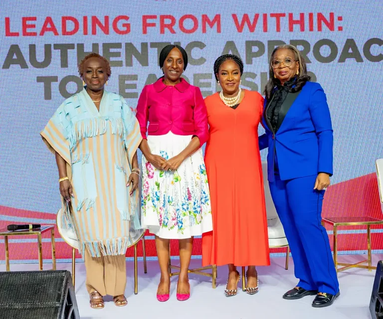 Four women standing together at the inaugural Executive Woman Summit