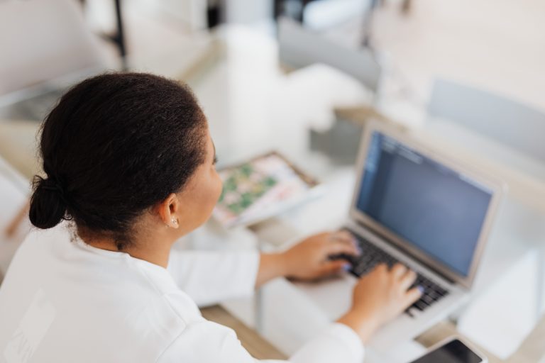 Her Startup Cohort 2.0 Opens Applications to African Women Founders 1 A woman works on a laptop at a bright desk