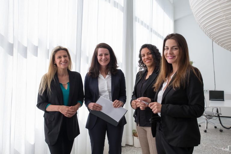 Illustrative stock photo of four women in business attire