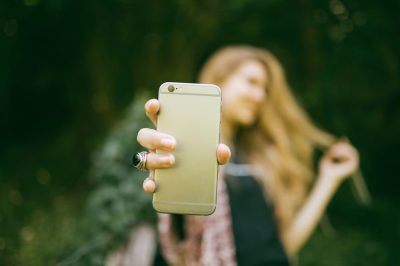 Woman taking a selfie in nature
