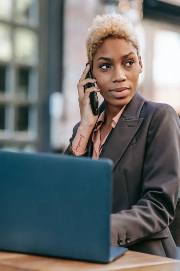 Black business woman at the phone, in the US new business owners are women